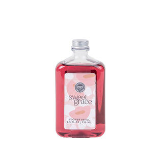 A bottle of Sweet Grace flower diffuser refill on a plain background.