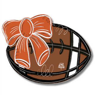 Decorative item with a bow on a football shape with 'DK MINI' branding.