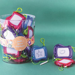 Colorful children's craft items in a cylindrical container on a green background