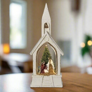 Resin church figure with Holy Family scene.