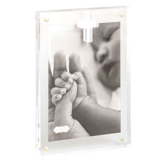 Clear photo frame with a black and white photo of a baby's foot and hand inside.