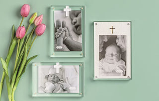 Set of photo frames on a wall with tulips on either side