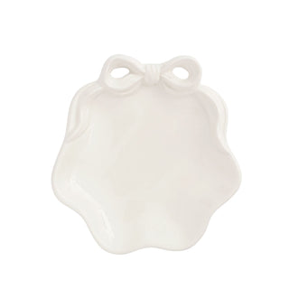 White ceramic shell-shaped dish on a white background