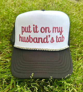 Put It On My Husband's Tab Trucker Hat: Black Split