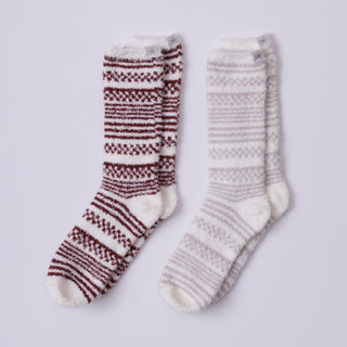 Two pairs of patterned socks on a light gray background