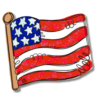 American flag cutout with a ruler for scale on a white background