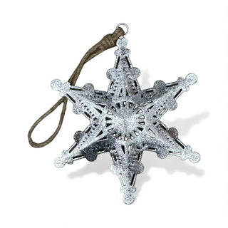 Decorative star ornament with glittery details on a white background