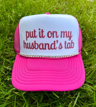 Put It On My Husband's Tab Trucker Hat: Black Split