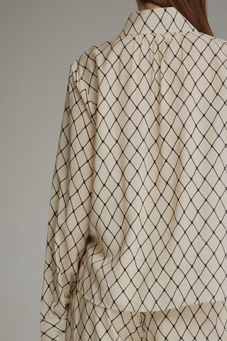 Geometric print long sleeve top with a split neckline